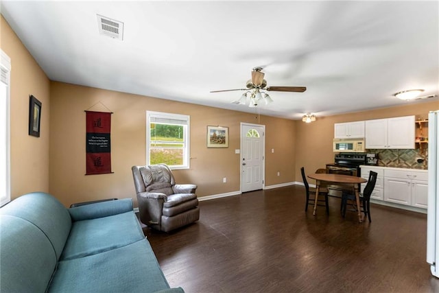 212 Postell Rd, Dallas, GA 30157 - living room featuring dark wood finished floors, ceiling fan, and baseboards