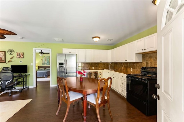 212 Postell Rd, Dallas, GA 30157 - dining area with ceiling fan, dark wood-style floors, a desk, and baseboards