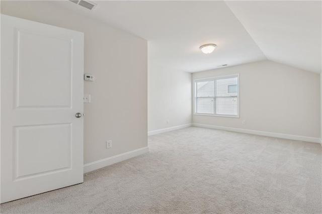 bonus room with vaulted ceiling, carpet flooring, and baseboards