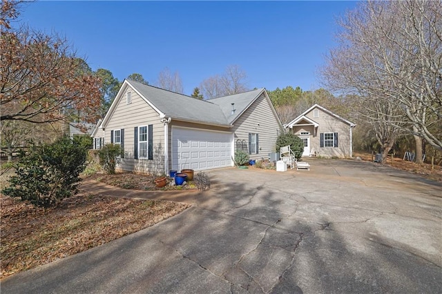 view of side of property with a garage