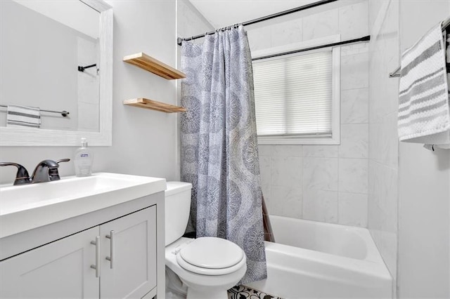 bathroom featuring toilet, vanity, and shower / tub combo