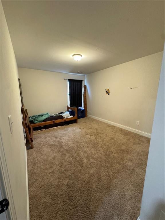 unfurnished bedroom featuring carpet