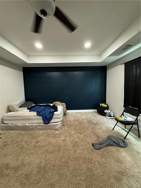 carpeted bedroom with ceiling fan