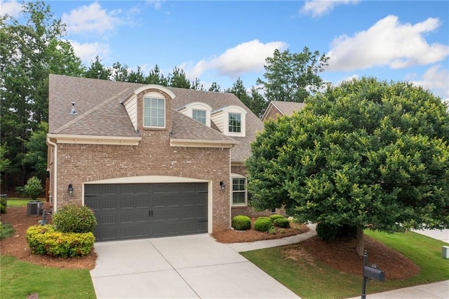 123 Meridian Dr, Woodstock, GA 30188 - view of front of property with driveway, roof with shingles, a garage, and brick siding