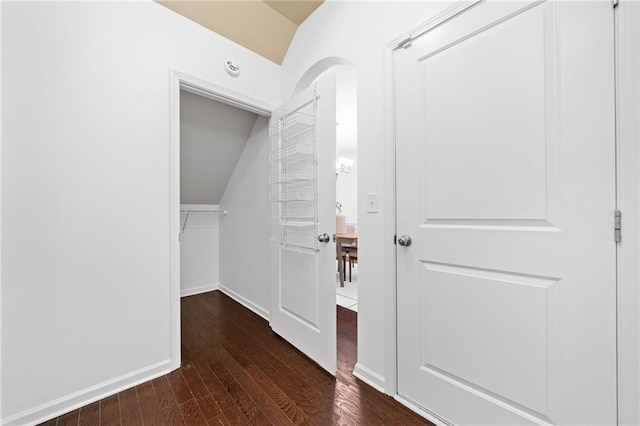 123 Meridian Dr, Woodstock, GA 30188 - corridor with lofted ceiling, wood-type flooring, baseboards, and arched walkways