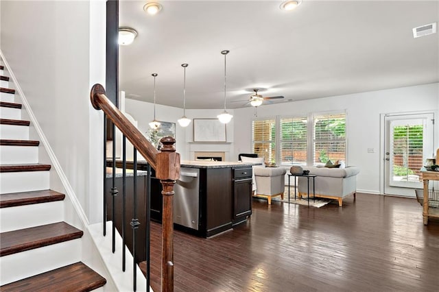 123 Meridian Dr, Woodstock, GA 30188 - kitchen with ceiling fan, open floor plan, dishwasher, a fireplace, and dark wood-style flooring