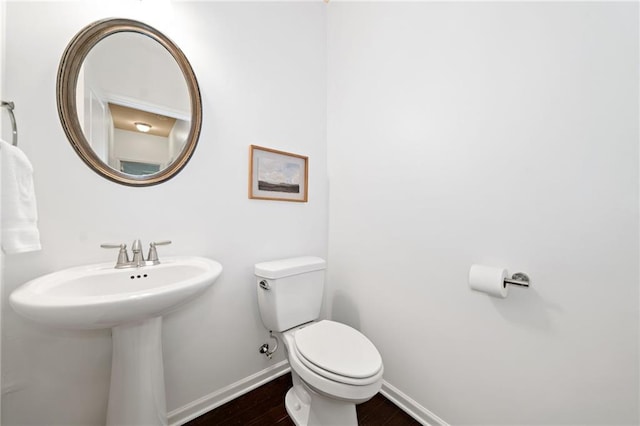 123 Meridian Dr, Woodstock, GA 30188 - bathroom with baseboards, toilet, wood finished floors, and a sink