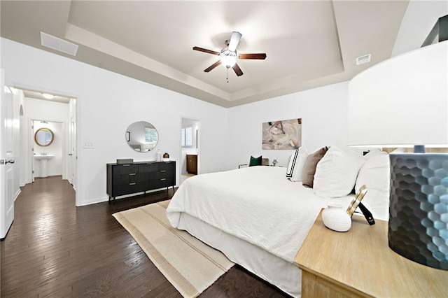 123 Meridian Dr, Woodstock, GA 30188 - bedroom with a raised ceiling, dark wood-style flooring, baseboards, and ceiling fan