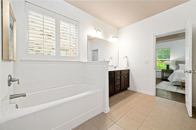 123 Meridian Dr, Woodstock, GA 30188 - bathroom with vanity, a garden tub, tile patterned floors, and connected bathroom