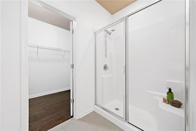 123 Meridian Dr, Woodstock, GA 30188 - bathroom featuring a shower stall and a walk in closet