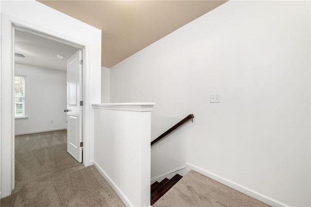 123 Meridian Dr, Woodstock, GA 30188 - hallway featuring an upstairs landing, carpet, and baseboards