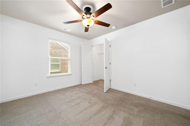 123 Meridian Dr, Woodstock, GA 30188 - unfurnished bedroom with carpet floors, baseboards, and ceiling fan