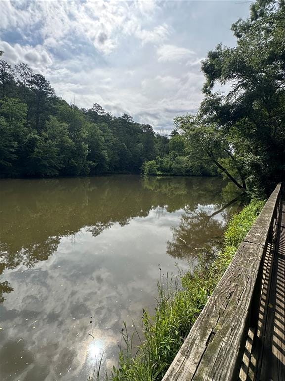 123 Meridian Dr, Woodstock, GA 30188 - water view with a heavily wooded area