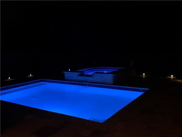 123 Meridian Dr, Woodstock, GA 30188 - pool at twilight featuring an in-ground hot tub and an outdoor pool
