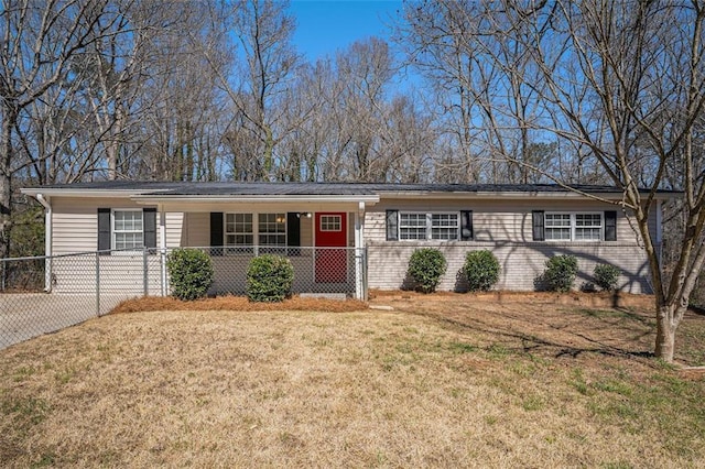 single story home featuring a porch and a front yard