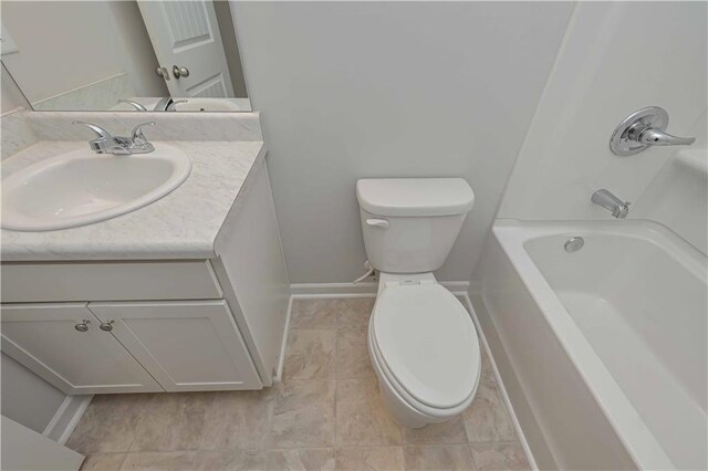 bathroom with tile patterned floors, toilet, shower / tub combination, vanity, and baseboards