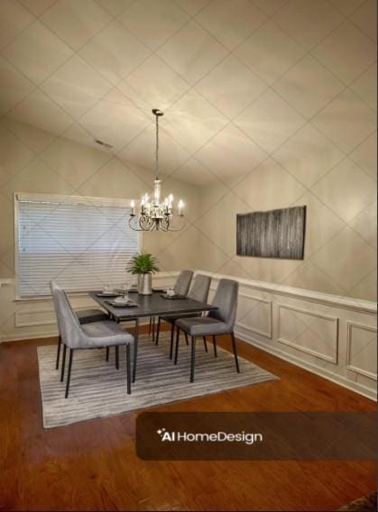 dining area with an inviting chandelier, a decorative wall, and wood finished floors