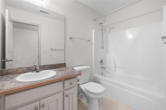 full bathroom with vanity, a textured ceiling, toilet, and shower / bathtub combination