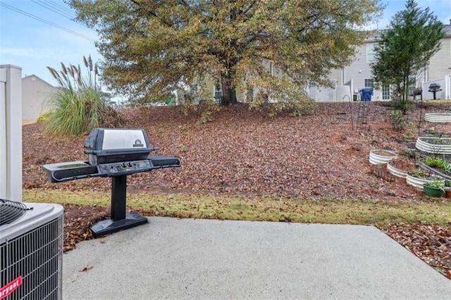 exterior space featuring central AC unit and a patio area