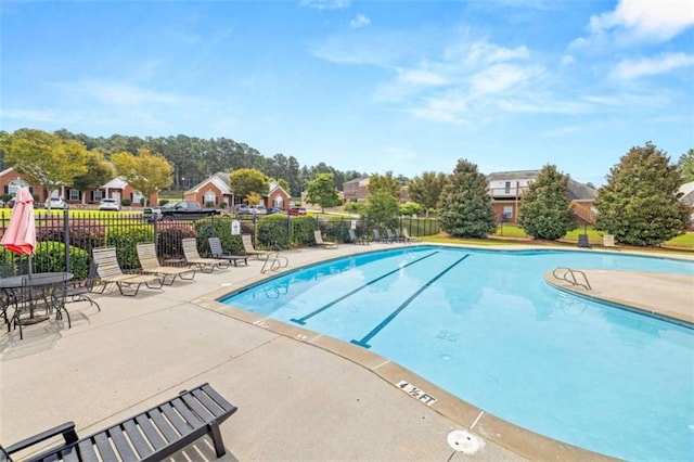 view of pool featuring a patio