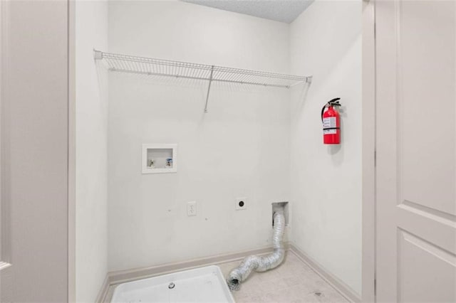 washroom with hookup for an electric dryer and washer hookup