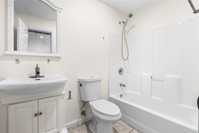 full bathroom featuring tile patterned flooring, baseboards, toilet, shower / bathing tub combination, and vanity