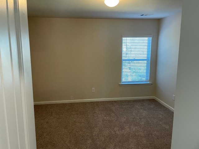 unfurnished room with carpet