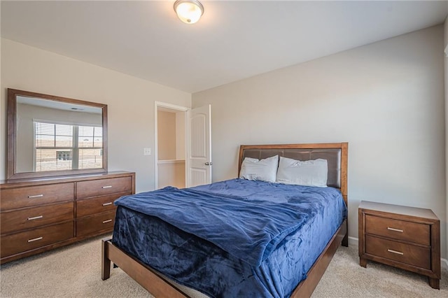 bedroom featuring light colored carpet