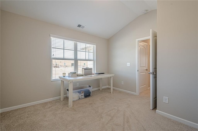 carpeted office space featuring visible vents, lofted ceiling, and baseboards