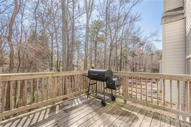 wooden terrace featuring grilling area