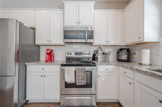 kitchen featuring white cabinetry and appliances with stainless steel finishes