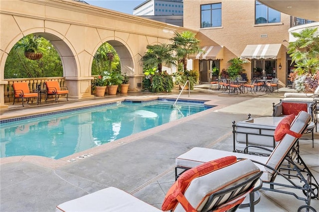 pool with a patio