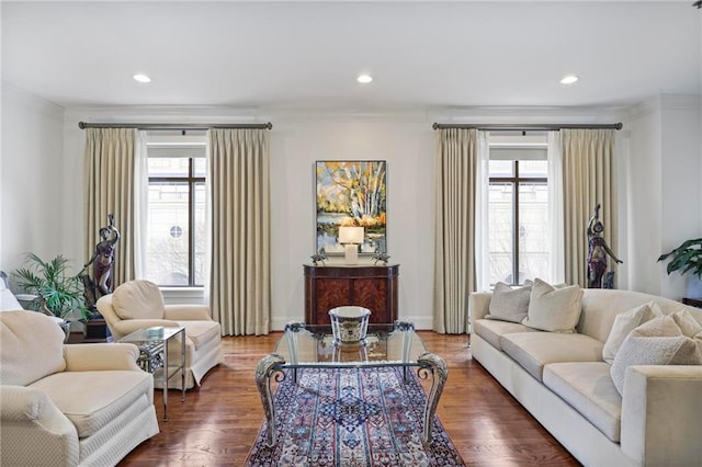 living room featuring recessed lighting, plenty of natural light, and wood finished floors