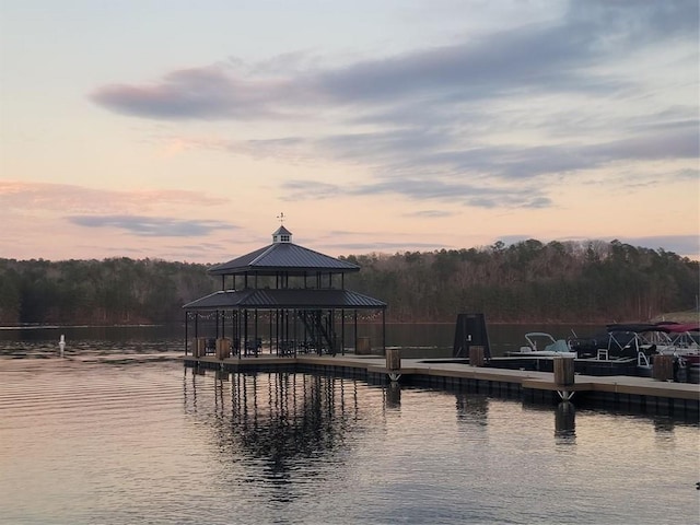 dock area with a gazebo and a water view