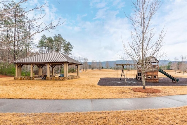 surrounding community featuring a mountain view, a gazebo, and a playground