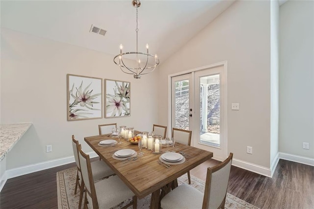 dining room featuring french doors, high vaulted ceiling, a chandelier, and dark hardwood / wood-style floors