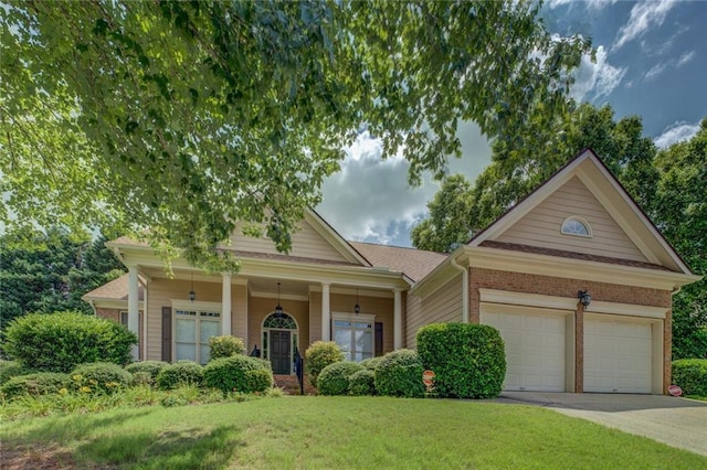 1065 Chippewa Oak Dr, Dacula, GA 30019 - view of front of property with a front lawn, driveway, an attached garage, and brick siding