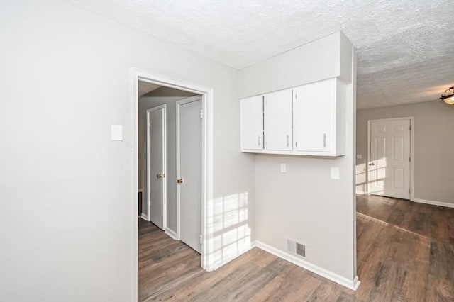 3406 Blackberry Ln, Villa Rica, GA 30180 - hallway featuring wood finished floors and a textured ceiling