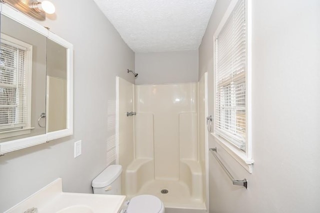 3406 Blackberry Ln, Villa Rica, GA 30180 - bathroom with a shower, vanity, and a textured ceiling