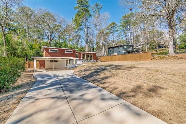 view of front of house featuring fence