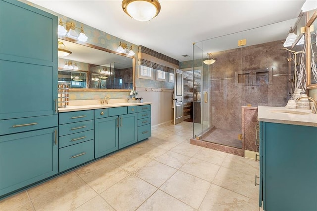 bathroom featuring an enclosed shower, vanity, and tile patterned flooring