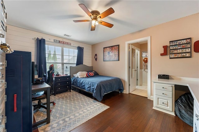 bedroom with ceiling fan and dark hardwood / wood-style flooring