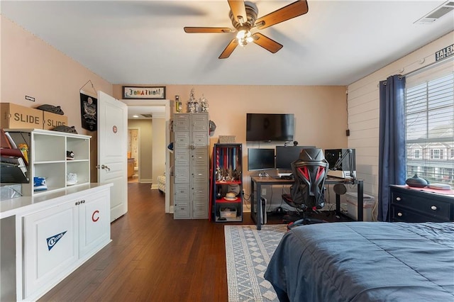 bedroom featuring ceiling fan and dark wood-type flooring