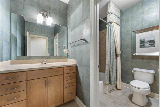 full bathroom featuring toilet, vanity, tile walls, tile patterned floors, and shower / tub combo with curtain