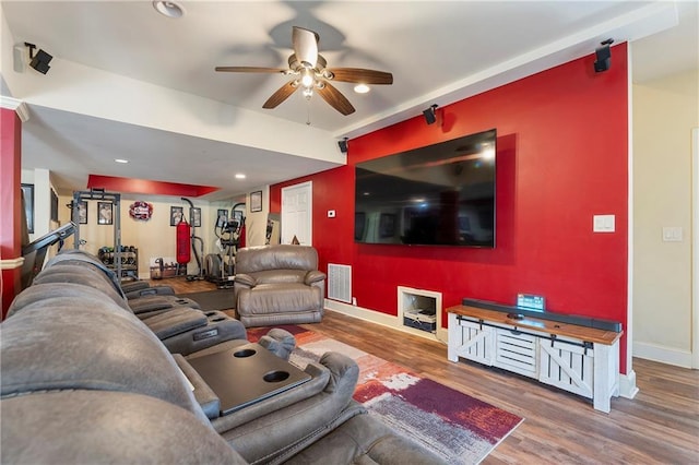 living room with ceiling fan and hardwood / wood-style flooring