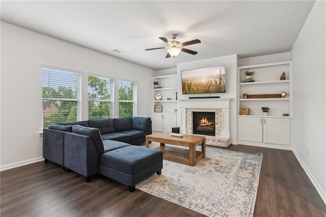 6360 Boulder Rdg, Cumming, GA 30028 - living area featuring a ceiling fan, a brick fireplace, dark wood finished floors, and baseboards