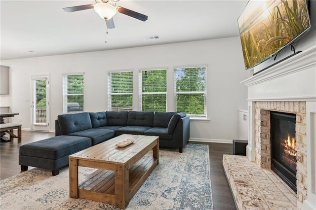 6360 Boulder Rdg, Cumming, GA 30028 - living room featuring ceiling fan, a fireplace, dark wood finished floors, and baseboards
