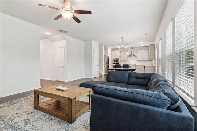 6360 Boulder Rdg, Cumming, GA 30028 - living area featuring ceiling fan, dark wood-type flooring, a chandelier, baseboards, and recessed lighting