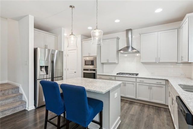 6360 Boulder Rdg, Cumming, GA 30028 - kitchen featuring stainless steel appliances, wall chimney range hood, dark wood-style floors, backsplash, and a center island