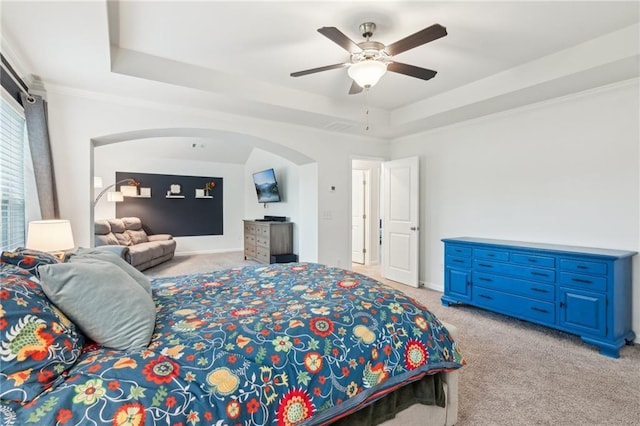 6360 Boulder Rdg, Cumming, GA 30028 - bedroom with light colored carpet, a tray ceiling, arched walkways, a ceiling fan, and baseboards